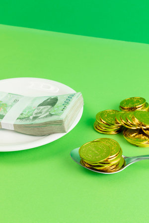 conceptual creative photo of monetary inflation, economic recession, crisis_cash and platesの写真素材