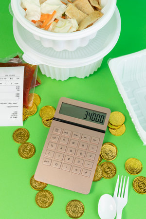 conceptual creative photo of monetary inflation, economic recession, crisis_delivery containers and calculatorsの写真素材