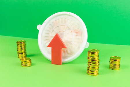 conceptual creative photo of monetary inflation, economic recession, crisis_delivery containers and coins, rising arrowsの写真素材
