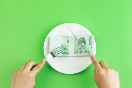conceptual creative photo of monetary inflation, economic recession, crisis_cash and platesの写真素材