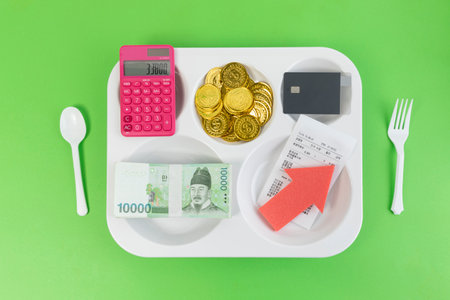 conceptual creative photo of monetary inflation, economic recession, crisis_food tray, cash, calculator.の写真素材