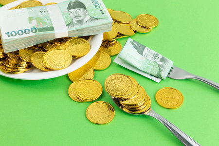 conceptual creative photo of monetary inflation, economic recession, crisis_cash and platesの写真素材