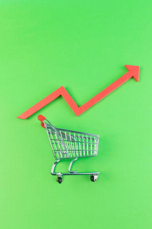 conceptual creative photo of monetary inflation, economic recession, crisis_shopping carts and rising arrowsの写真素材