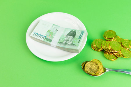 conceptual creative photo of monetary inflation, economic recession, crisis_cash and platesの写真素材