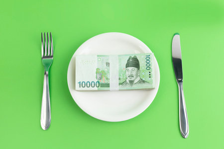 conceptual creative photo of monetary inflation, economic recession, crisis_cash and plates