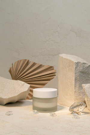 creative photo of nature and beauty products, cream and jewelsの写真素材