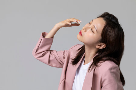 common health problems of office workers, korean young woman_dry eyeの写真素材