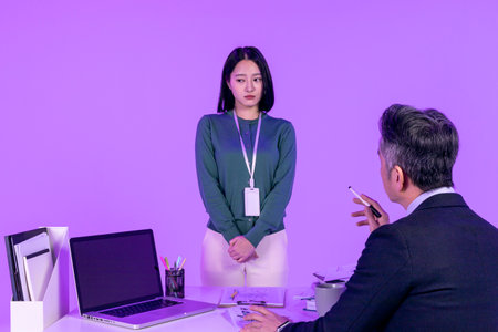 relationship and conflict between younger and older workers concept, Korean Asian young woman and manager level older manの写真素材