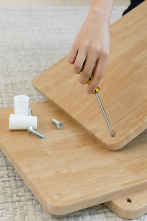 DIY interior hand motion, closeup_assemble furnitureの写真素材