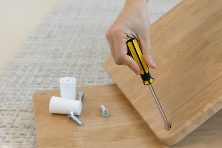 DIY interior hand motion, closeup_assemble furnitureの写真素材