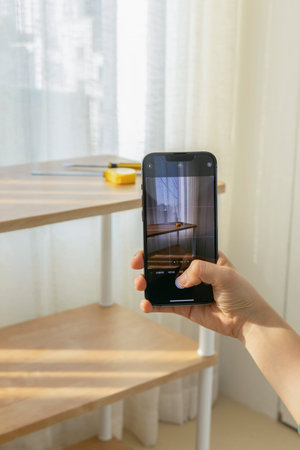 DIY interior hand motion, closeup_taking pictures of finished furniture