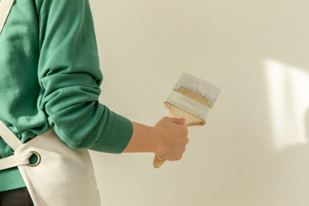 DIY interior hand motion, closeup_holding a paint brush