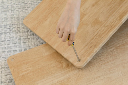 DIY interior hand motion, closeup_assemble furniture