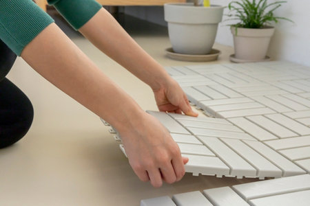 DIY interior hand motion, closeup_tile a floorの写真素材