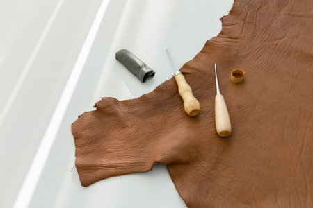 aesthetic photo of handmade, crafting hobbies, leather and awl