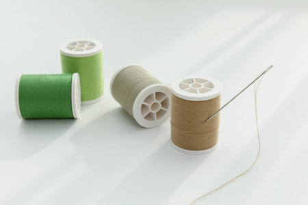 aesthetic photo of handmade, crafting hobbies, thread and a needle