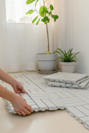 DIY interior hand motion, closeup_tile a floor