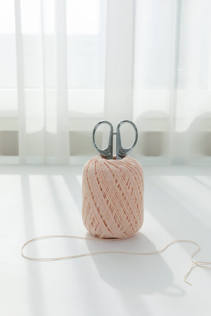 aesthetic photo of handmade, crafting hobbies, knitting thread and scissors