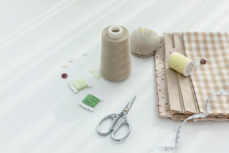 aesthetic photo of handmade, crafting hobbies, tape measure of fabric and measure of thread scissors