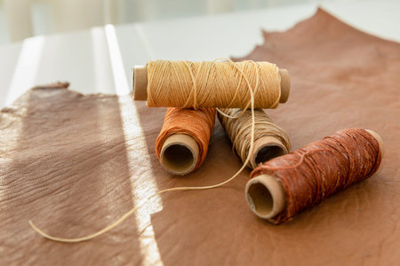 aesthetic photo of handmade, crafting hobbies, leather and wax thread tools