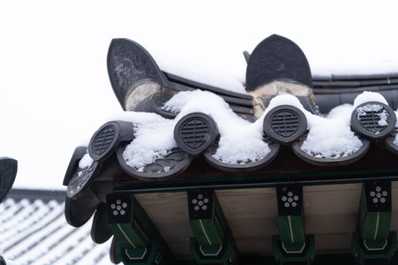 snow covered Korean traditional roof tileの写真素材