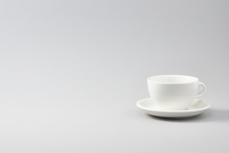 Cup of ceramic on top of white backgroundの写真素材