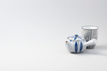 Cup of ceramic on top of white backgroundの写真素材