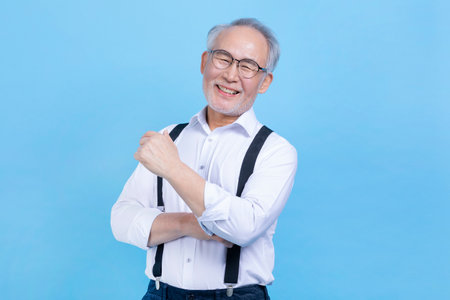 happy active young senior Korean Asian woman standingの写真素材