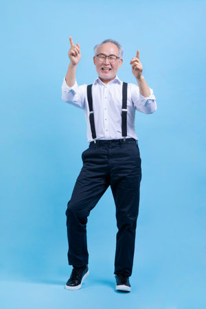 active young senior Korean Asian male dancingの写真素材