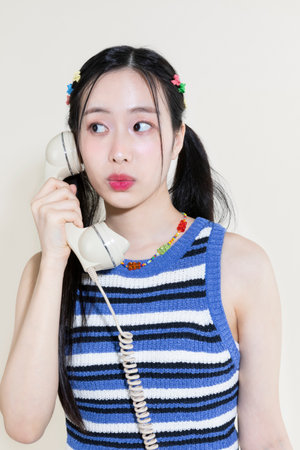 vintage y2k pink retro concept photo of korean asian cute woman callingの写真素材