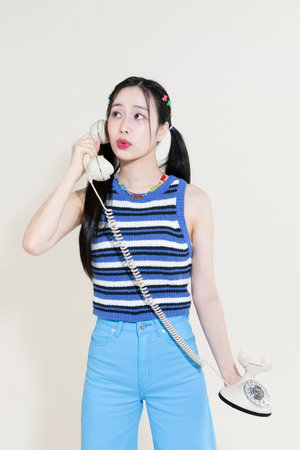 vintage y2k pink retro concept photo of korean asian cute woman callingの写真素材