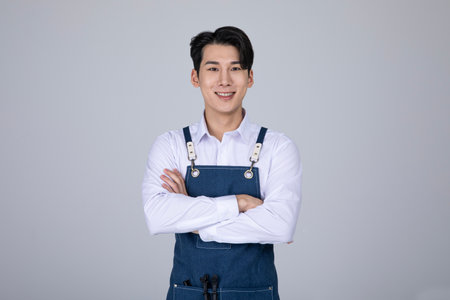 millennials and gen z, korean asian young man with crossed armsの写真素材