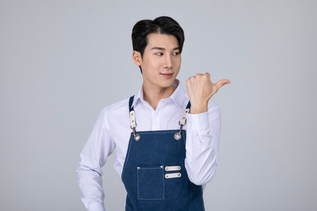 millennials and gen z, korean asian young man pointingの写真素材