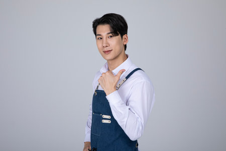 millennials and gen z, korean asian young man with hand motionの写真素材