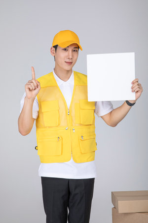 millennials and gen z, korean asian young man holding a frame panelの写真素材