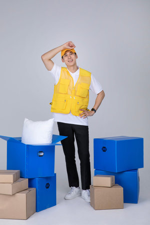 millennials and gen z, korean asian young man organizing moving boxes
