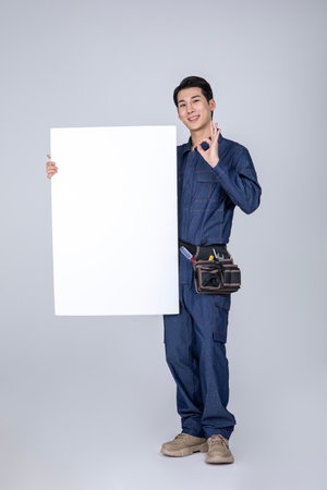 millennials and gen z, korean asian young man, site staff with a frame panelの写真素材