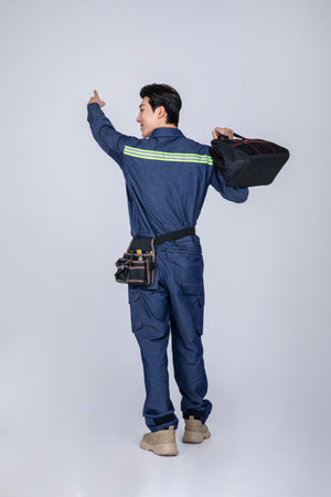 millennials and gen z, korean asian young man, site staff pointingの写真素材