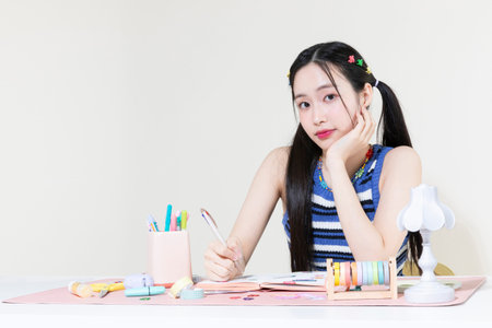 vintage y2k retro concept photo of korean asian cute woman decorating diaryの写真素材