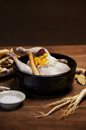 korean traditional food samgyetang, chicken soup with ginseng and herbsの写真素材