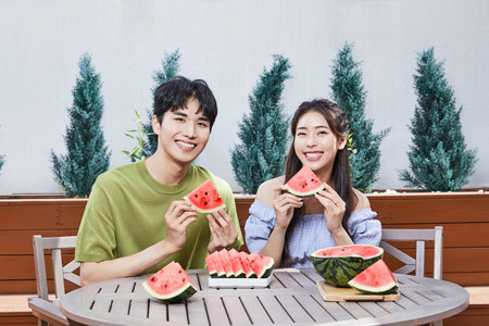 summer lifestyle, korean asian young couple with watermelonの写真素材