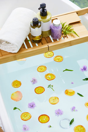 a bathtub with various bathing accessories, both products