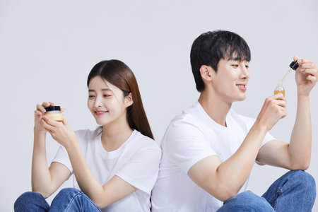 korean asian young couple with cosmeticsの写真素材