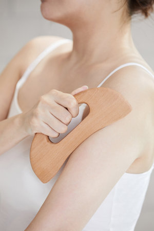 beauty concept photo of korean asain beautiful woman with massage machineの写真素材