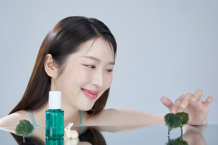 beauty concept photo of korean asain beautiful woman with mirror and cosmeticの写真素材