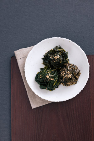 The dried vegetables are put on a plate on a wooden tray