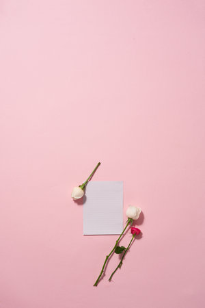 roses around an empty piece of paperの写真素材
