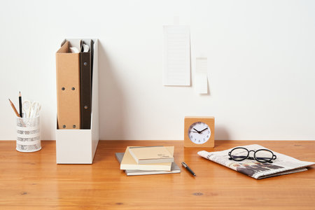 filing cabinets and office supplies on wooden desksの写真素材