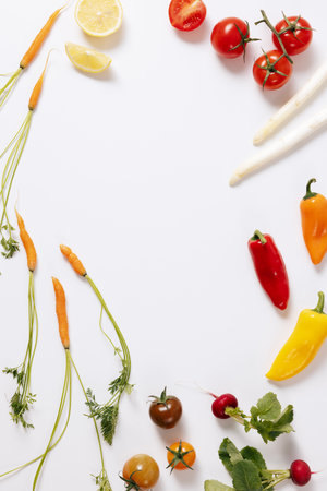 various vegetables arranged in a circular pattern on a white backgroundの写真素材