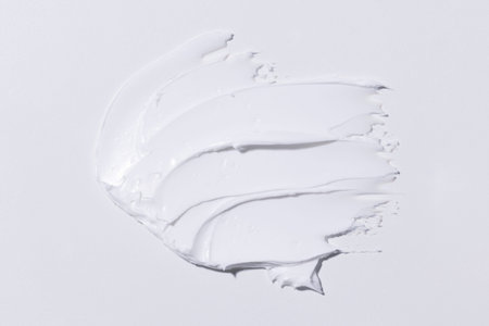 It's a soft white cosmetic cream on a white background